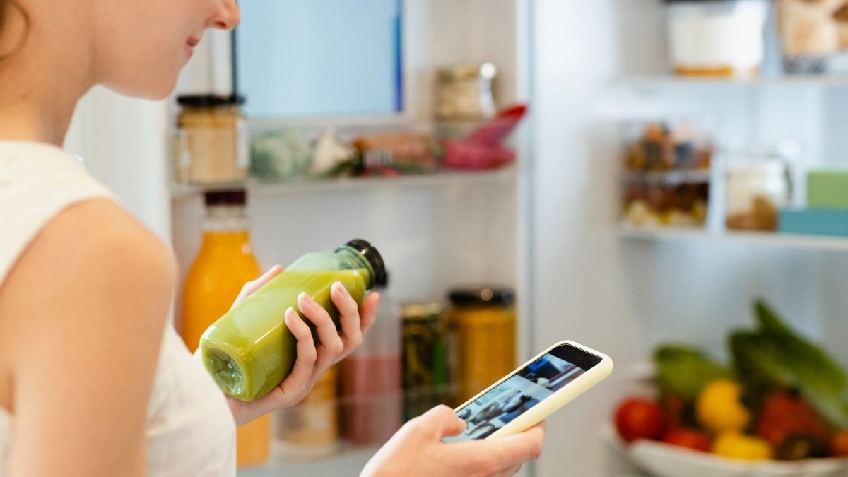 A woman holding an organic juice