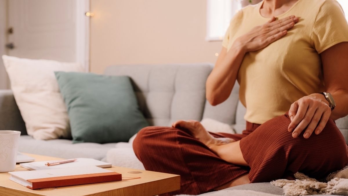 A woman managing her stress through breathing exercises<br />
